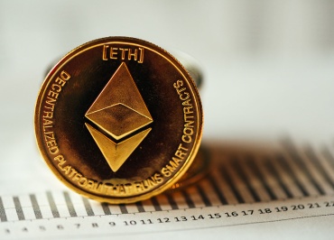 A Person Holding a Golden SHIB Coin